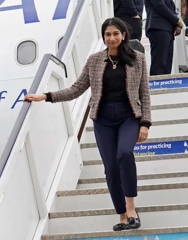 Suella Braverman disembarks her plane as she arrives at Kigali International Airport for her visit to Rwanda - Saturday March 18, 2023.