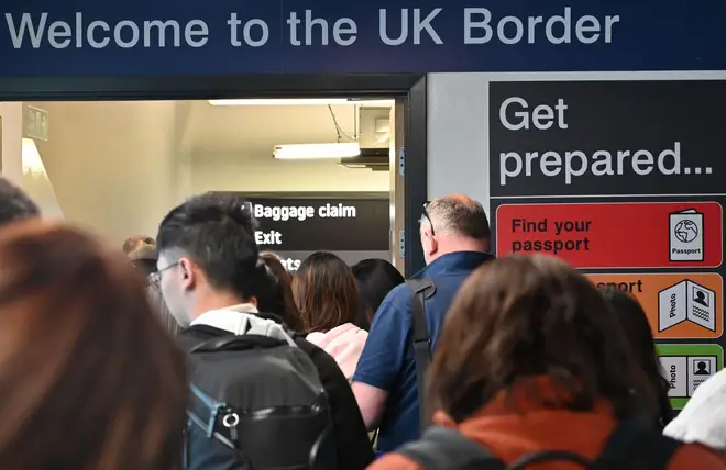 Welcome to the UK Boarder sign as passengers arrive back in the UK at Luton Airport. May 2023.