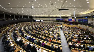Members of the European Parliament participate in a series of votes as they attend a plenary session at the European Parliament in Brussels