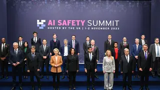 Attendees pose for a group photograph at the AI safety summit