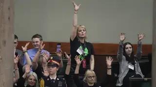 Abortion rights activists react during a debate in the Polish parliament from the gallery of the assembly, in Warsaw, Poland