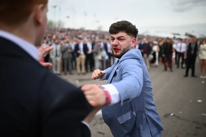 A brawl erupts on the second day of the Grand National Festival horse race meeting at Aintree Racecourse in Liverpool