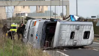 The minibus lying on its side