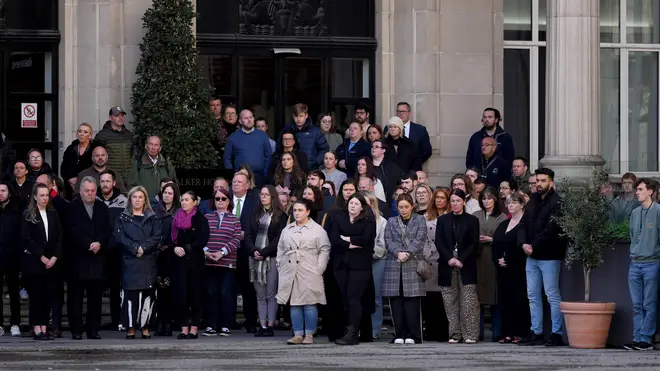 People pay their respects on the 35th Anniversary Of Hillsborough disaster and observe a silence as the town hall bell chimes once for every victim