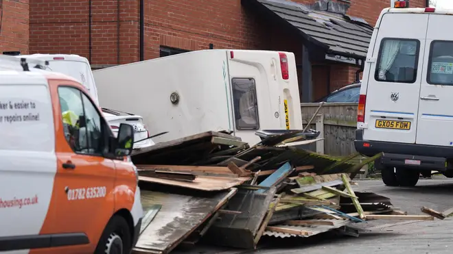 Debris and an overturned caravan on St Gile's Road in Knutton, North Staffordshire.