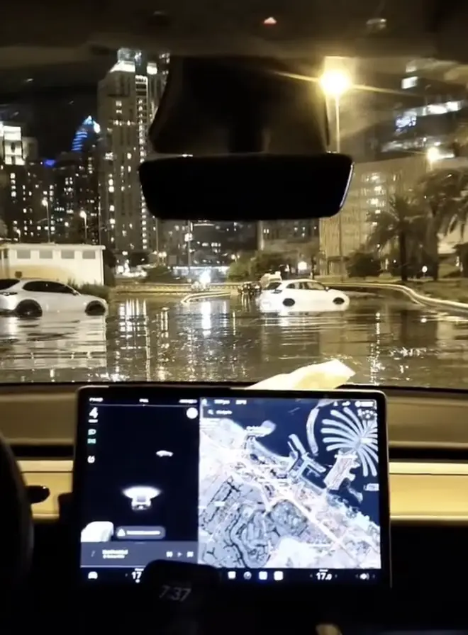 A driver films the flooded streets of Dubai