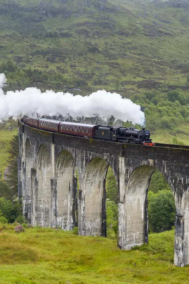 The train travels over the Glenfinnan viaduct