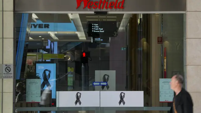 A man walks past the entrance to the Westfield shopping centre at Bondi Junction in Sydney