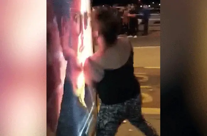 Woman headbutts bus stop