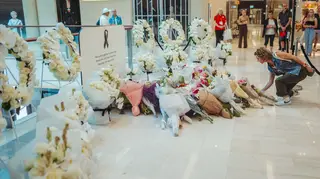 Flowers left inside the Westfield shopping centre in Bondi Junction, Sydney, where the stabbing took place