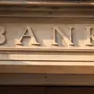 A carved stone bank sign