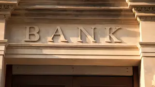 A carved stone bank sign