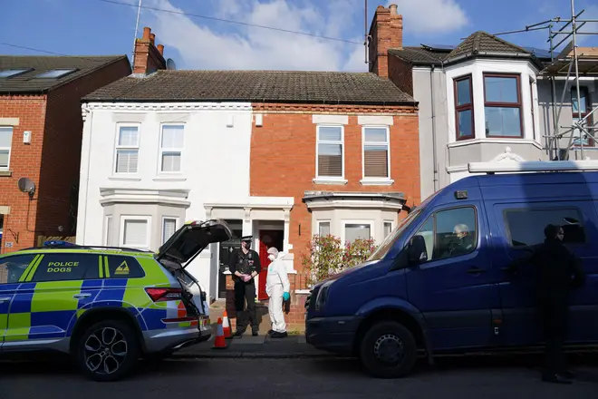 Forensic officers at the scene in Moore Street, Kingsley, Northampton following a discovery of a body in a rear garden