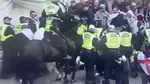 Police clash with a group of 'far right' people in London for a St George's Day event