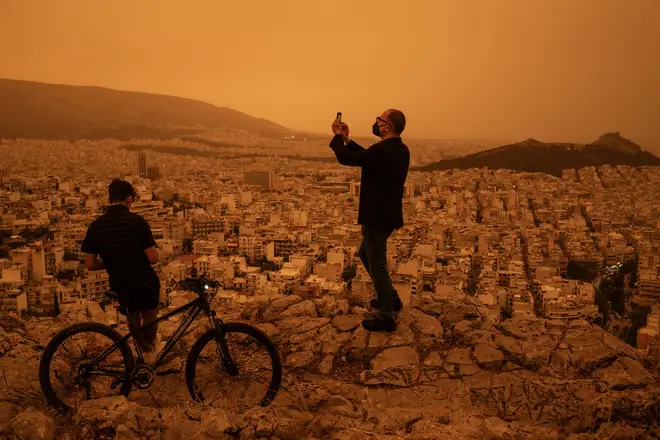 Athens residents take selfies of the orange-hued dust that engulfed the city