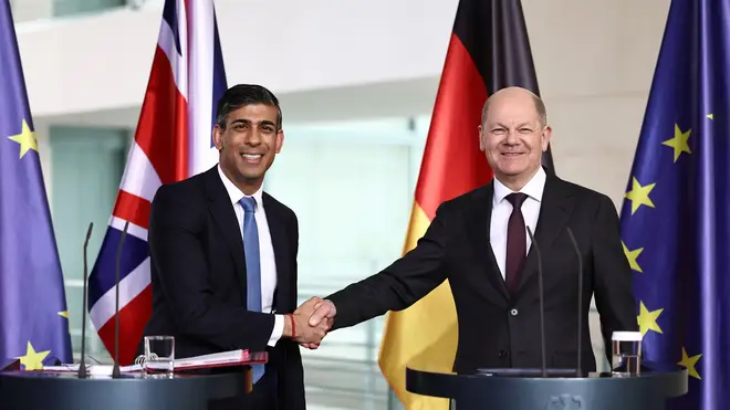 Rishi Sunak and Olaf Scholz shake hands during a joint press conference