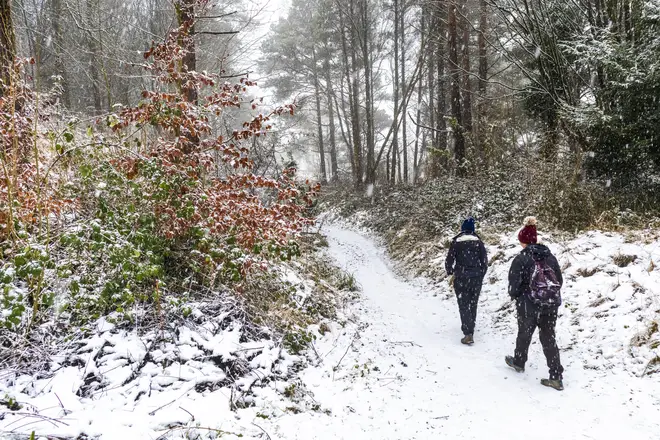 File photo of people enjoying a walk during snow