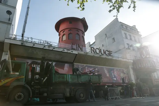 A builder's truck removes the Moulin Rouge's famous blades