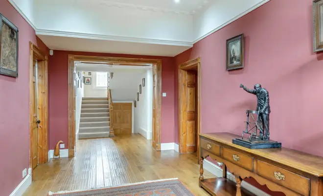 A statue of Captain Tom on show inside the house's online listing