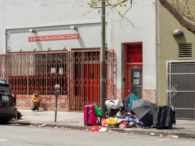 SAN FRANCISCO, CA – May 6, 2018: Homeless and drug users line up outside Tenderloin Housing Clinic. The neighborhood is symbolic of San Francisco’s ho