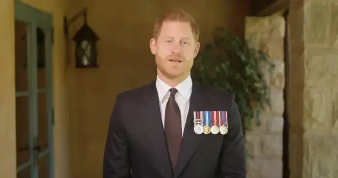 Prince Harry dons his medals to present a soldier of the year award to US combat medic