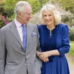 King Charles III and Queen Camilla pictured together in the gardens of Buckingham Palace