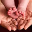 Baby and adult hands