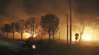 Buildings burn in the town of Mati, east of Athens, Greece, in July 2018
