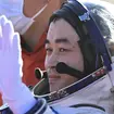 Chinese astronaut Tang Shengjie waves after returning to Earth