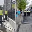 Officials in high-vis jackets remove the 'tent city' of asylum seekers in Dublin