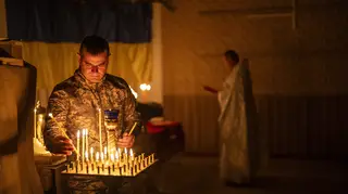 Ukrainian soldier lighting candles