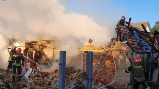 Rescuers work at a damaged building after a Russian missile attack in Kyiv region, Ukraine