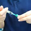 Nurse prepares MMR vaccine at GP health centre