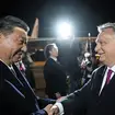 Xi Jinping shakes hands with Viktor Orban