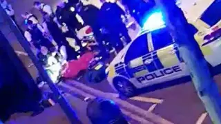 The police officer receives attention following the incident in Leyton