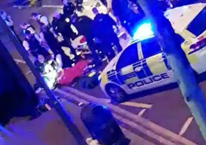 The police officer receives attention following the incident in Leyton