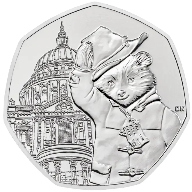 One coin has the bear lifting his hat outside St Paul's Cathedral