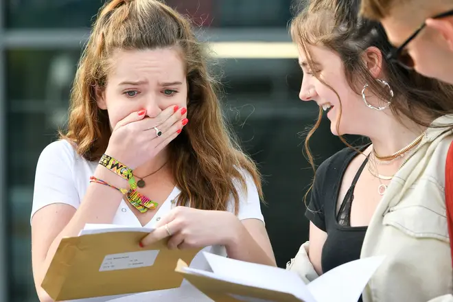 A Sixth Former reacts as she opens her A Level results
