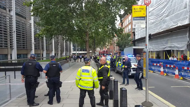 Armed Police cordon off the scene outside the Home Office