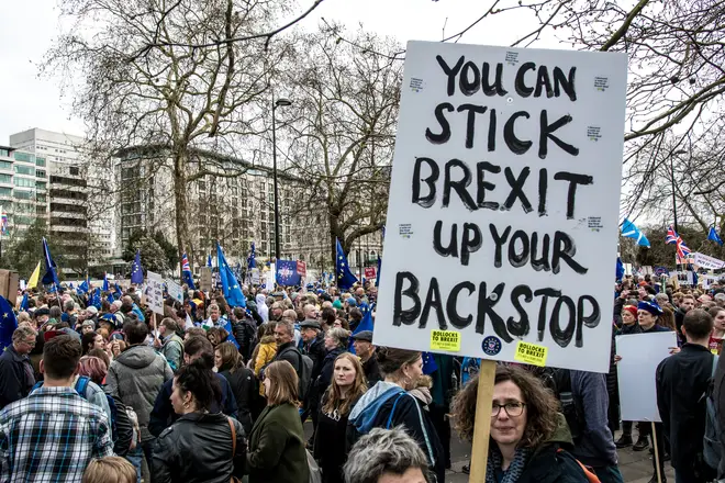 A protester seen holding a placard that says you can stick Brexit up your backstop during the People's Vote demonstration.