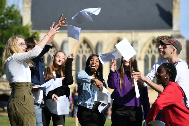 Pupils celebrate their GCSE results at Norwich School in Norfolk.