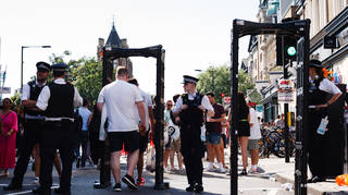 Police with screening arches at the Notting Hill Carnival