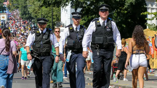Police officers at this year's Notting Hill Carnival, where a woman had part of her lip bitten off