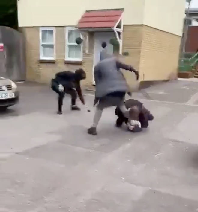 The victim appears to bite one of the attacker's legs during the attack