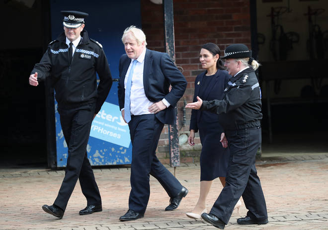 The PM visited the facility with Home Secretary Pritti Patel