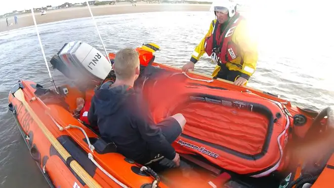 A man was rescued after the toy dinghy he was in was blown a mile out to sea.