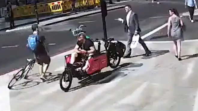 Police are hunting a 'road rage' cyclist after a pedestrian was attacked