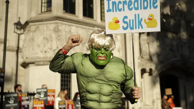 A protester dressed up as Boris Johnson as the 'Incredible Sulk' outside the Supreme Court
