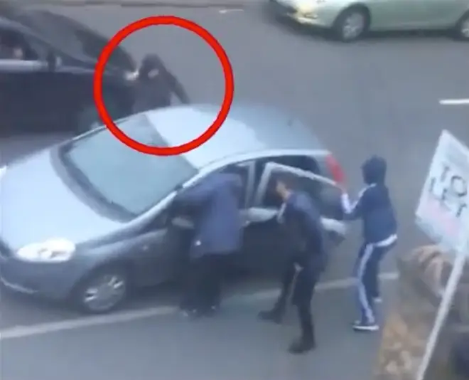 The moment a man is stabbed to death on a busy street.