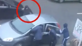 The moment a man is stabbed to death on a busy street.